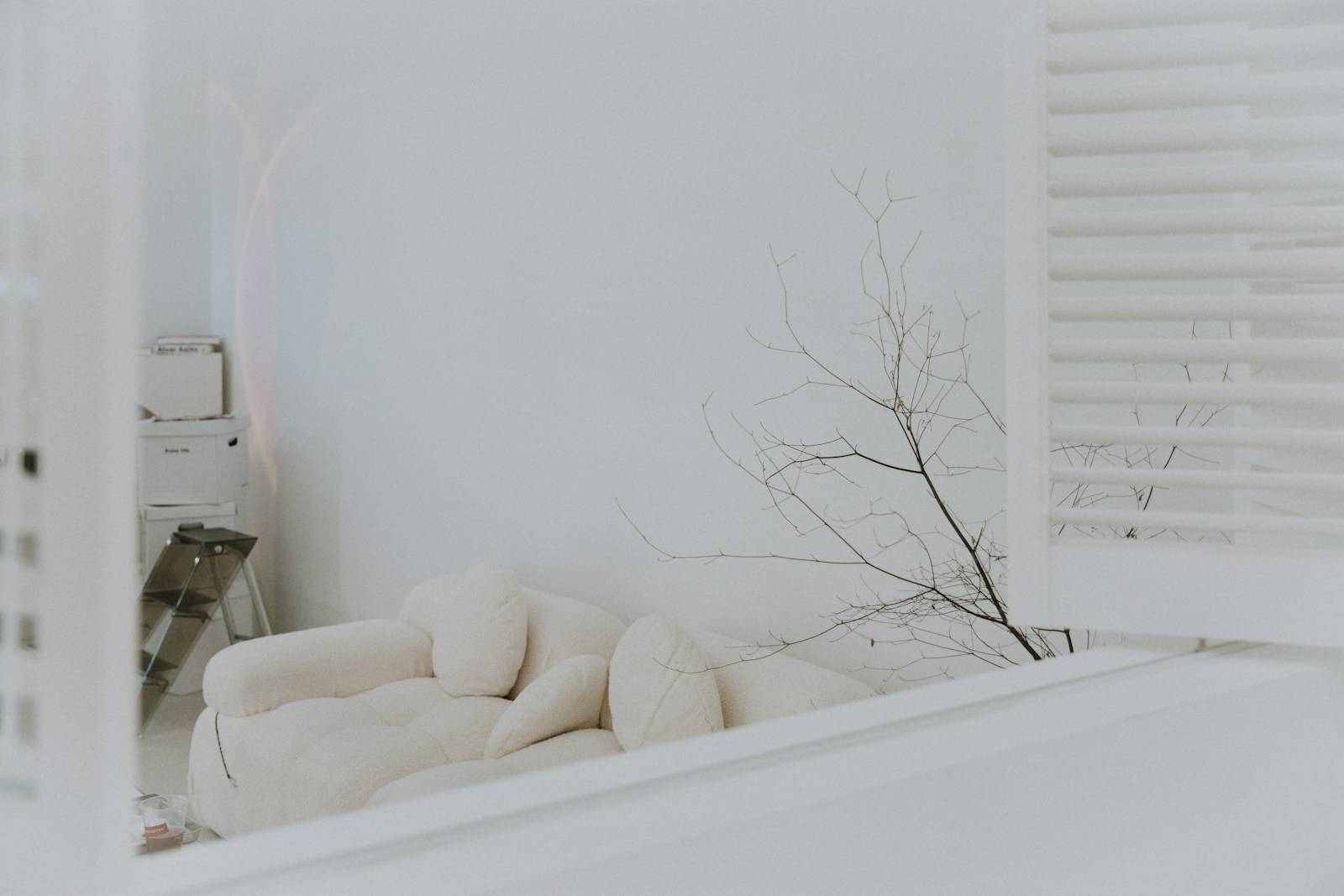 white sofa near white wall